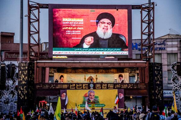 People gather to watch Hezbollah Secretary-General Hassan Nasrallah's speech regarding the Israel–Hamas conflict in Tehran, Iran, on Nov. 3, 2023. (HOSSEIN BERIS/Middle East Images/AFP via Getty Images)