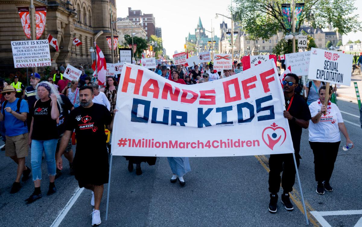 Protesters taking part in the parental rights event 1 Million March for Children gather near Parliament Hill in Ottawa on Sept. 20, 2024. (The Canadian Press/Spencer Colby)