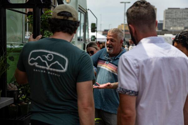 Roots, Shoots and Leaves owner Marc Eaton helps customers during the St. Paul Food Truck Festival at Union Depot Lot C in St. Paul, Minnesota, on July 14, 2024. (Ayrton Breckenridge/The Minnesota Star Tribune/TNS)