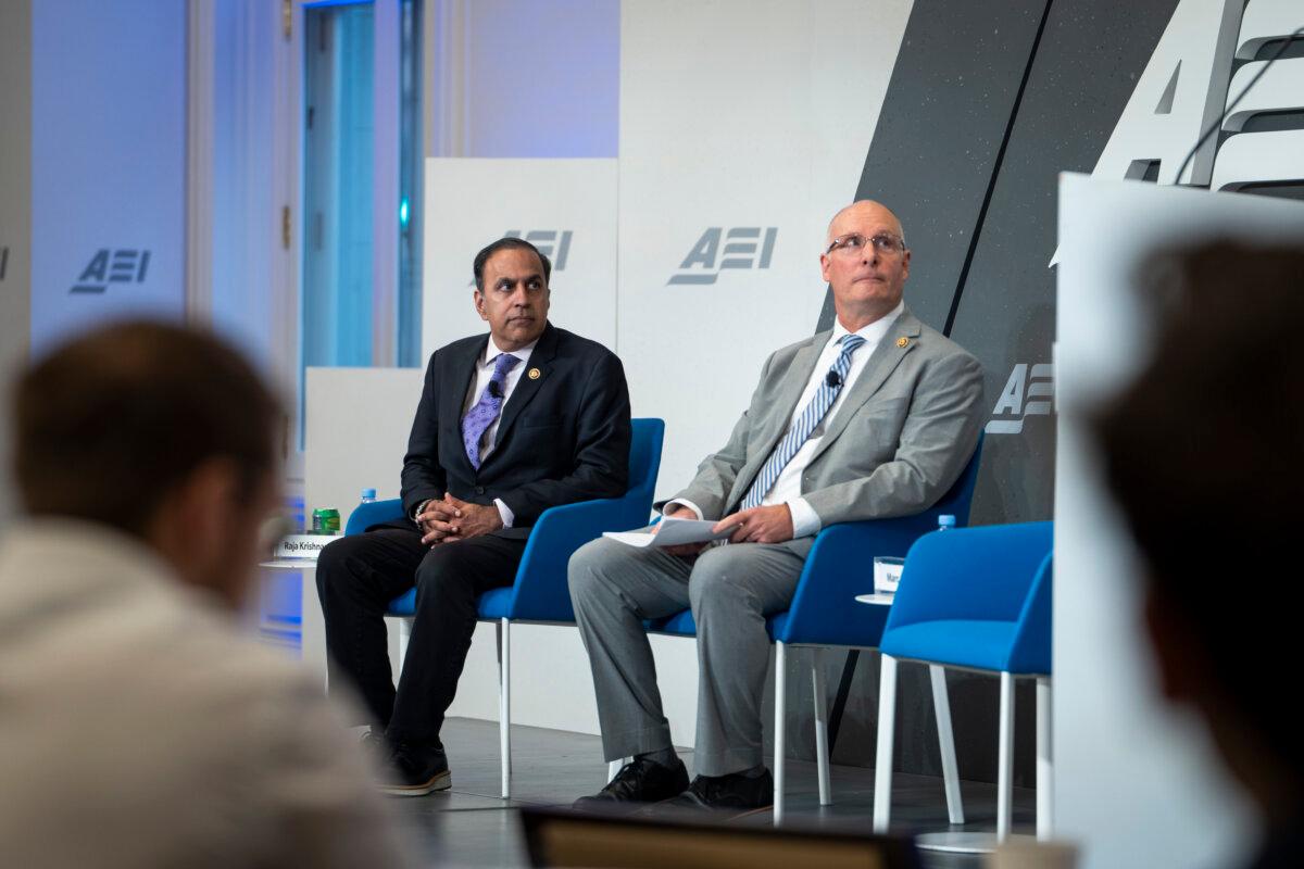 Ranking member of the House Select Committee on the strategic competition between the U.S. and the CCP Rep. Raja Krishnamoorthi (D-Ill.) (L) and the chairman of the committee Rep. John Moolenaar (R-Mich.) (R) speak at the American Enterprise Institute (AEI) in Washington on Sept. 25, 2024. (Madalina Vasiliu/The Epoch Times)