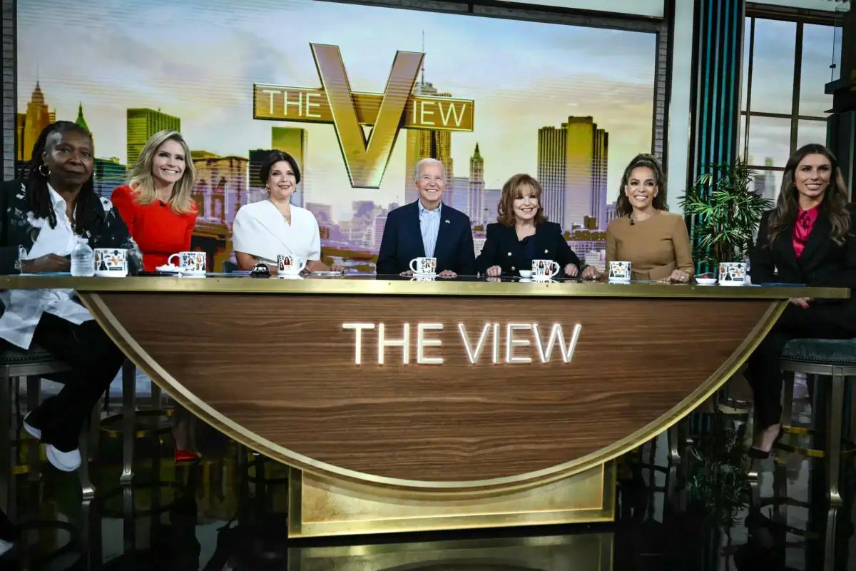 President Joe Biden (C) attends a live interview on "The View" in New York on Sept. 25, 2024. From left, the hosts are Whoopi Goldberg, Sara Haines, Ana Navarro, Joy Behar, Sunny Hostin, and Alyssa Farah Griffin. (Andrew Caballero-Reynolds/AFP via Getty Images)