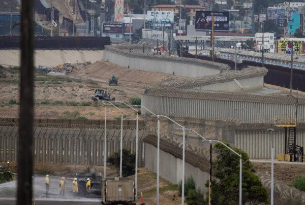 Crews work on the Tijuana River outside of San Diego, Calif., on Sept. 19, 2024. (John Fredricks/The Epoch Times)