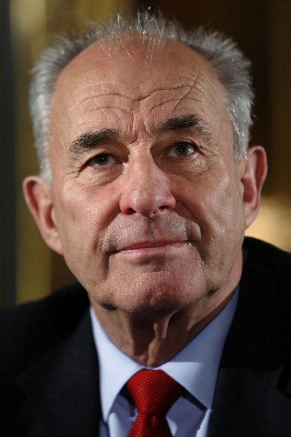 Former NZ Foreign Minister and Commonwealth Secretary-General Don McKinnon listens to a statement during a press conference at the Commonwealth Headquarters in London, on Nov. 12, 2007. (Leon Neal/AFP via Getty Images)