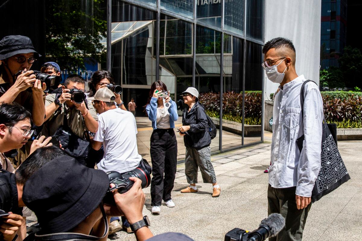 Patrick Lam (R), the former acting chief editor of Hong Kong's now-shuttered pro-democracy news outlet Stand News, arrives at the district court in Hong Kong on Sept. 26, 2024. (Issac Lawrence/AFP via Getty Images)
