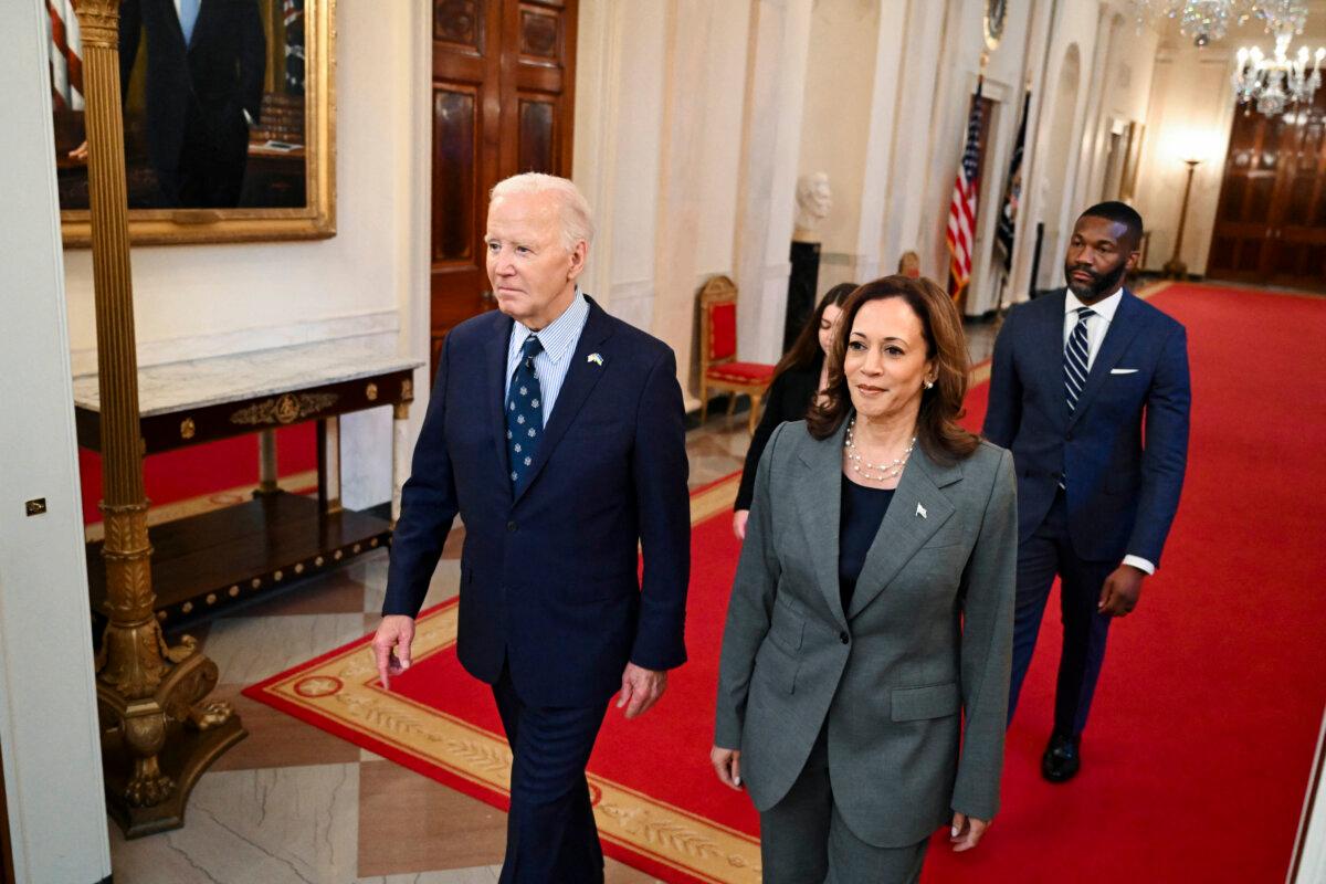 President Joe Biden and Vice President Kamala Harris walk to an event on gun violence in the East Room of the White House on Sept. 26, 2024. (Saul Loeb/AFP)