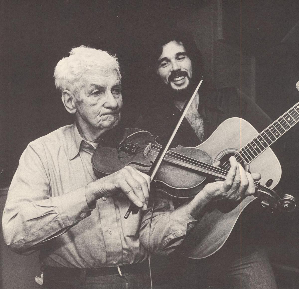 A father and son jam session pictured inside the 1978 album "Variations" by Eddie Rabbitt. Internet Archive. (Public Domain)