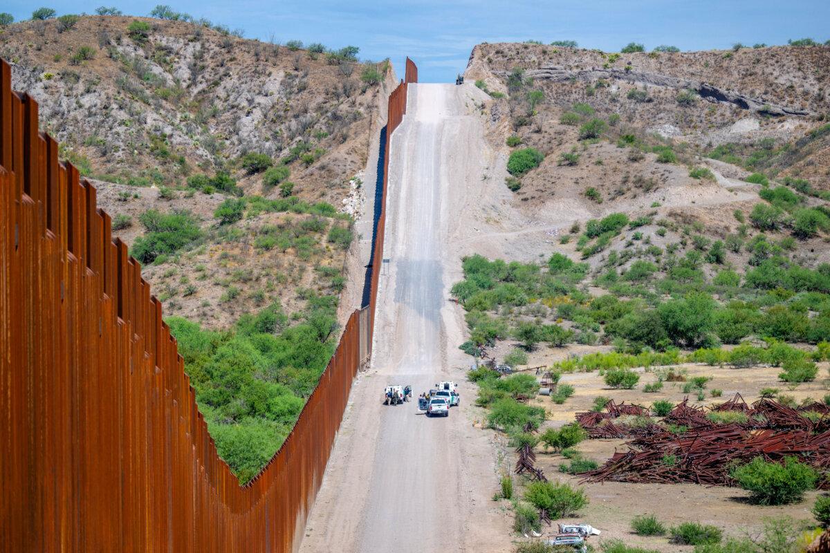 A group of illegal immigrants are apprehended by U.S. Customs and Border protection officers after crossing over into the United States, in Ruby, Ariz., on June 26, 2024. (Brandon Bell/Getty Images)