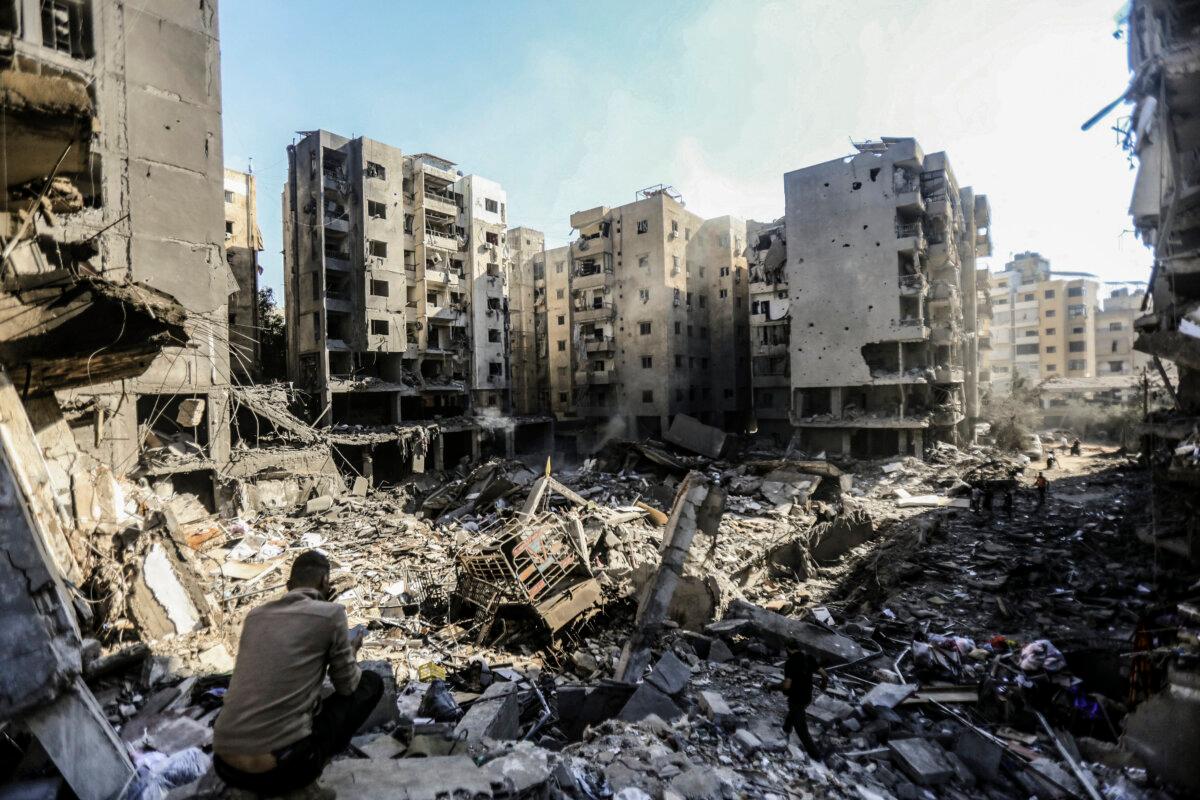 People search the rubble of buildings in the Haret Hreik neighborhood of Beirut, Lebanon, on Sept. 29 following Israeli air strikes that killed Hezbollah Secretary-General Hassan Nasrallah on Sept. 27, 2024. (AFP via Getty Images)