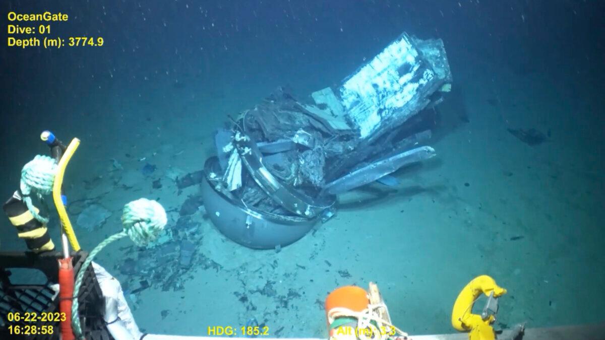 Remains of the Titan submersible (C) on the floor of the Atlantic Ocean in June 2023 in a still frame from video. (U.S. Coast Guard Video courtesy Pelagic Research Services via AP)