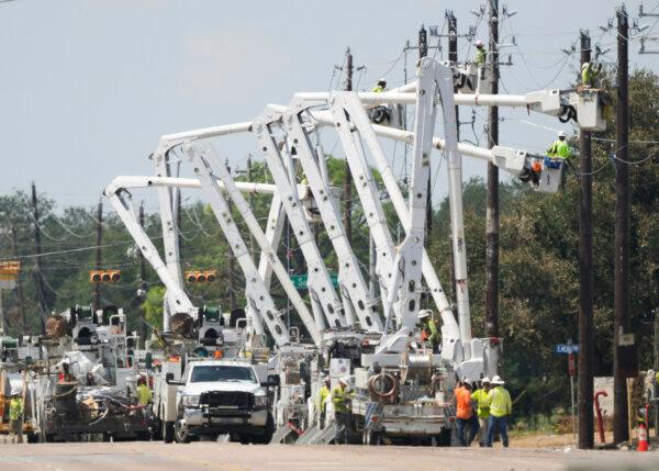 Utility work continues electrical lines along the westbound portion of Spencer Highway near the site of pipeline exposition, in La Porte, Texas on Sept. 18, 2024. (Jason Fochtman/Houston Chronicle via AP)