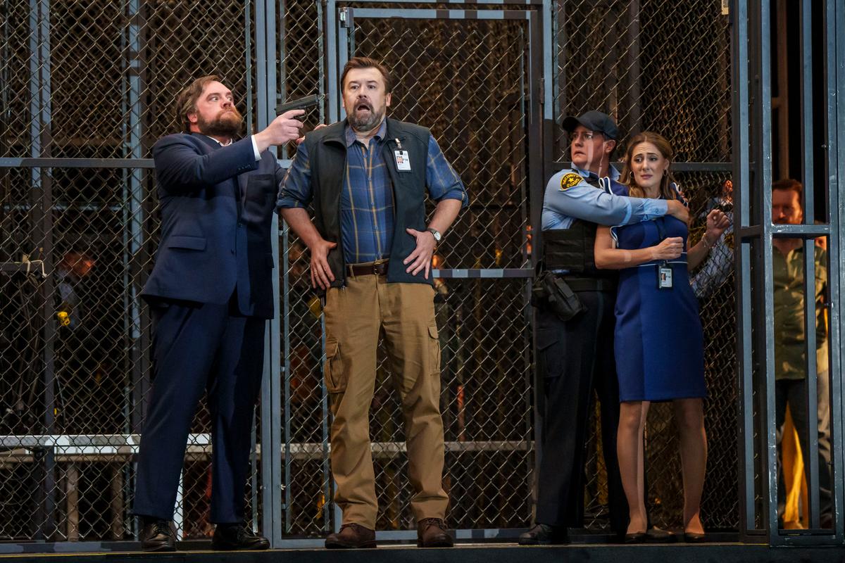 (L–R) Pizzaro (Brian Mulligan), Rocco (Dimitry Ivashchenko), Leonore (Elza van den Heever), and Marzelline (Sydney Mancasola) in Lyric Opera Chicago's production of "Fidelio." (Todd Rosenberg)