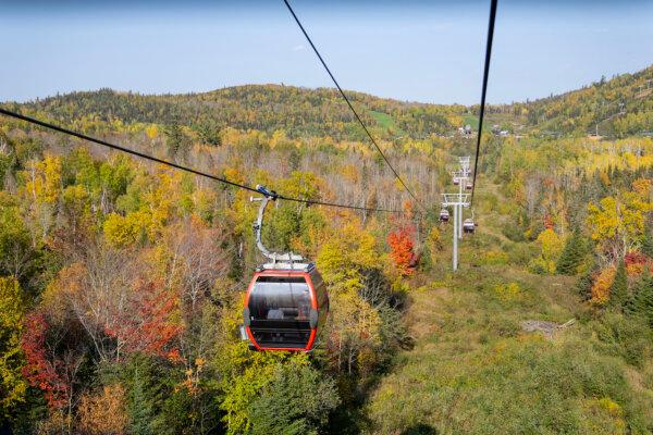 Visitors view fall colors on the Sawtooth Mountains while riding the Summit Express Gondola in Lutsen, Minnesota, on Oct. 3, 2023. (Alex Kormann/Minnesota Star Tribune/TNS)