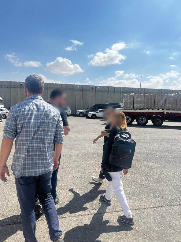 Fawzia Amin Sido (R) being taken through the Kerem Shalom crossing after being rescued from Gaza, in a photo released on Oct. 3, 2024. (Israel Defense Forces)