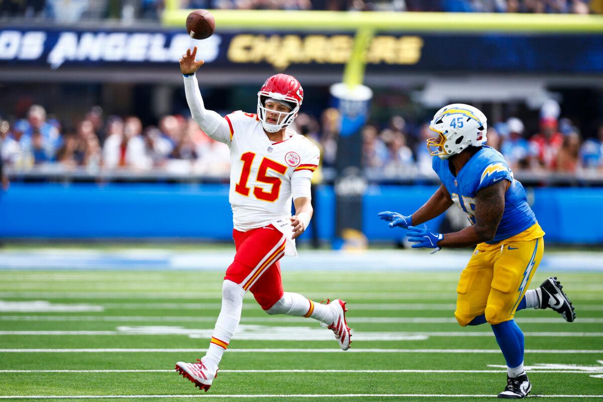 Patrick Mahomes #15 of the Kansas City Chiefs throws the ball as Tuli Tuipulotu #45 of the Los Angeles Chargers pursues during the first half at SoFi Stadium in Inglewood, Calif., on Sept. 29, 2024. (Ronald Martinez/Getty Images)