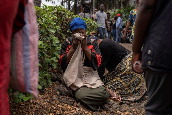 Women grieve at the port of Goma, Democratic Republic of Congo, after a ferry carrying hundreds capsized on arrival on Oct. 3, 2024. (Moses Sawasawa/AP Photo)