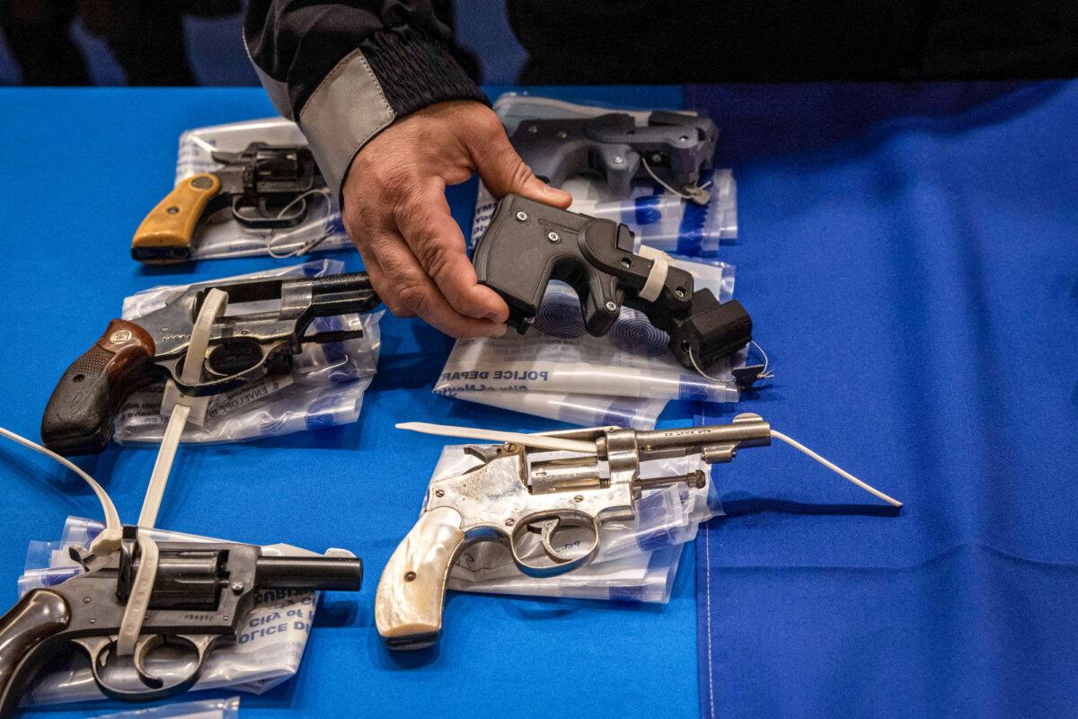 A person holds a 3D-printed ghost gun during a weapon buyback event held by the office of the New York State Attorney General in New York City on April 29, 2023. (Yuki Iwamura/AFP via Getty Images)