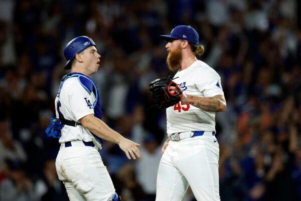 Pitcher Michael Kopech and catcher Will Smith of the Los Angeles Dodgers celebrate defeating the San Diego Padres 7–2 to win the NL West Division at Dodger Stadium on Sept. 26, 2024. (Kevork Djansezian/Getty Images)