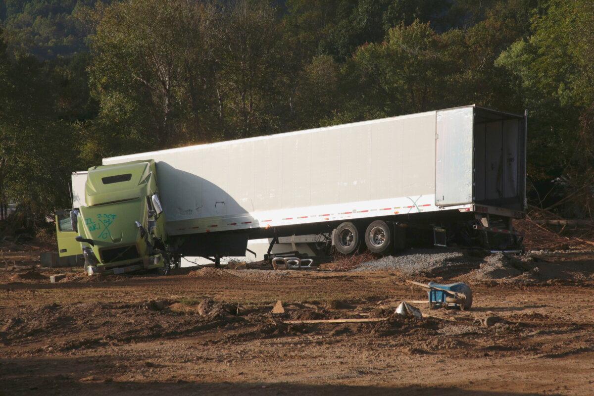 A wrecked truck is stranded in a bed of mud in Swannanoa, N.C., on Oct. 2, 2024. (Richard Moore/The Epoch Times)