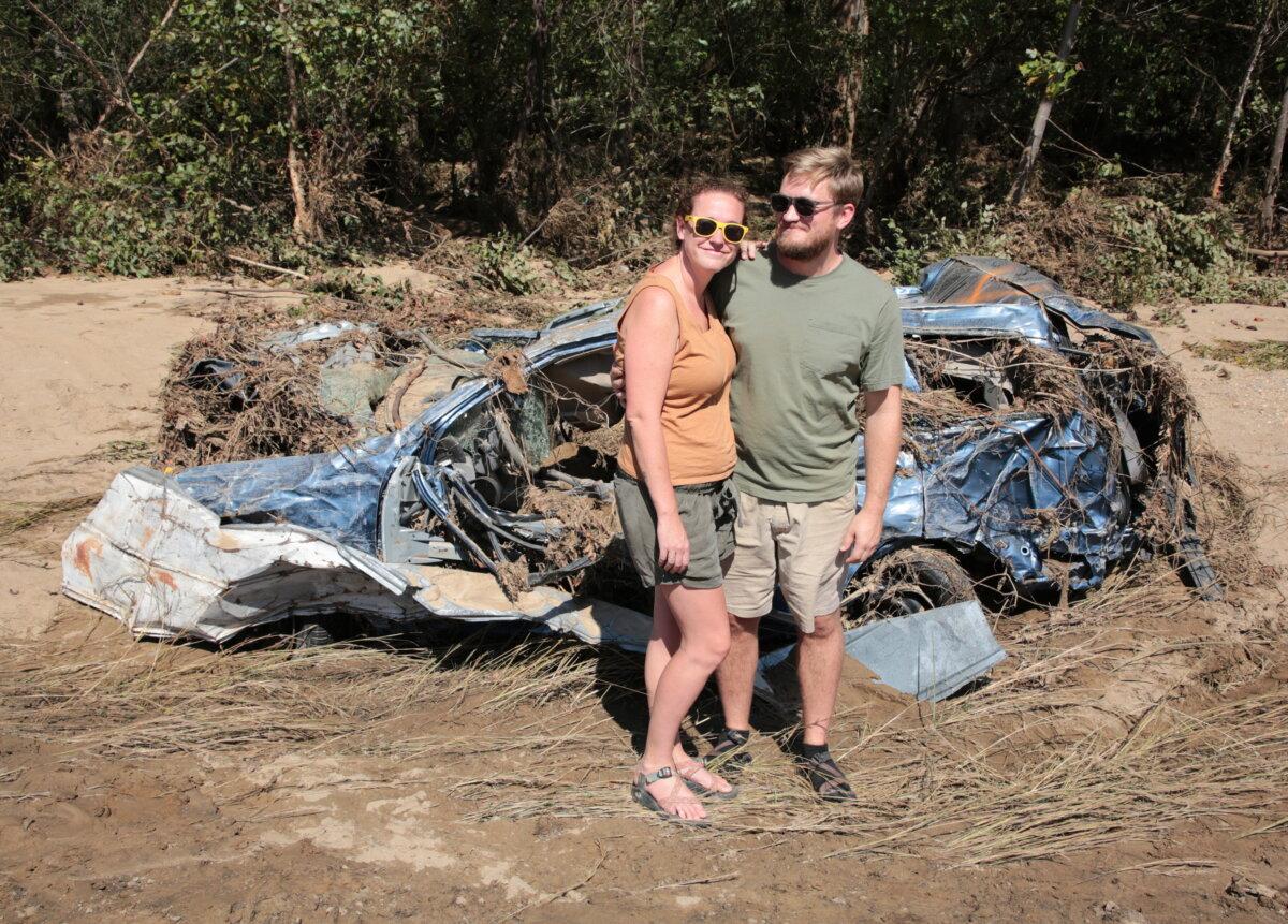 Michael and Brhianna Stapleton after escaping the flooding in Old Fort, near Asheville, N.C. Photo taken on Oct. 4, 2024. (Richard Moore/The Epoch Times)