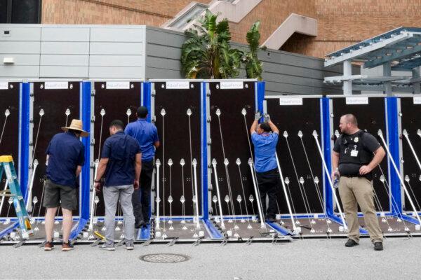 An AquaFence flood wall is put into place around Tampa General Hospital ahead of Hurricane Milton's expected mid-week landfall in Tampa, Fla., on Oct. 8, 2024. (Bryan R. Smith/AFP via Getty Images)