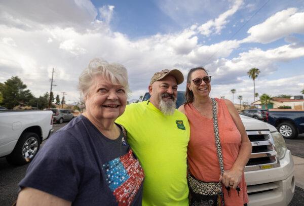 Ann (L), Troy (M), and Trisha (R) Goddard finish the early voting process in Tucson, AZ., on Oct. 9, 2024. (John Fredricks/The Epoch Times)