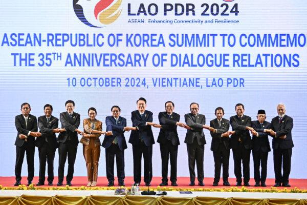 (L-R) Myanmar's Permanent Secretary of Foreign Affairs Aung Kyaw Moe, Philippines' President Ferdinand Marcos Jr, Singapore's Prime Minister Lawrence Wong, Thailand's Prime Minister Paetongtarn Shinawatra, Vietnam's Prime Minister Pham Minh Chinh, South Korea's President Yoon Suk Yeol, Laos' Prime Minister Sonexay Siphandone, Malaysia's Prime Minister Anwar Ibrahim, Brunei's Sultan Hassanal Bolkiah, Cambodia's Prime Minister Hun Mamet, Indonesia's Vice Prime Minister Ma'ruf Amin and East Timor's Prime Minister Kay Rala Xanana Gusmao pose for a group photo at the 25th ASEAN-South Korea in Vientiane, Laos, on Oct. 10, 2024. (Nhac Nguyen/AFP via Getty Images)