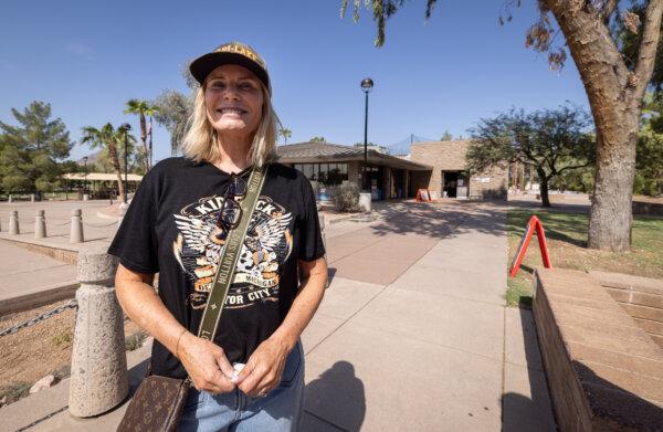 Susan Rosener finishes casting her early ballot in Scottsdale, AZ., on Oct. 10, 2024. (John Fredricks/The Epoch Times)