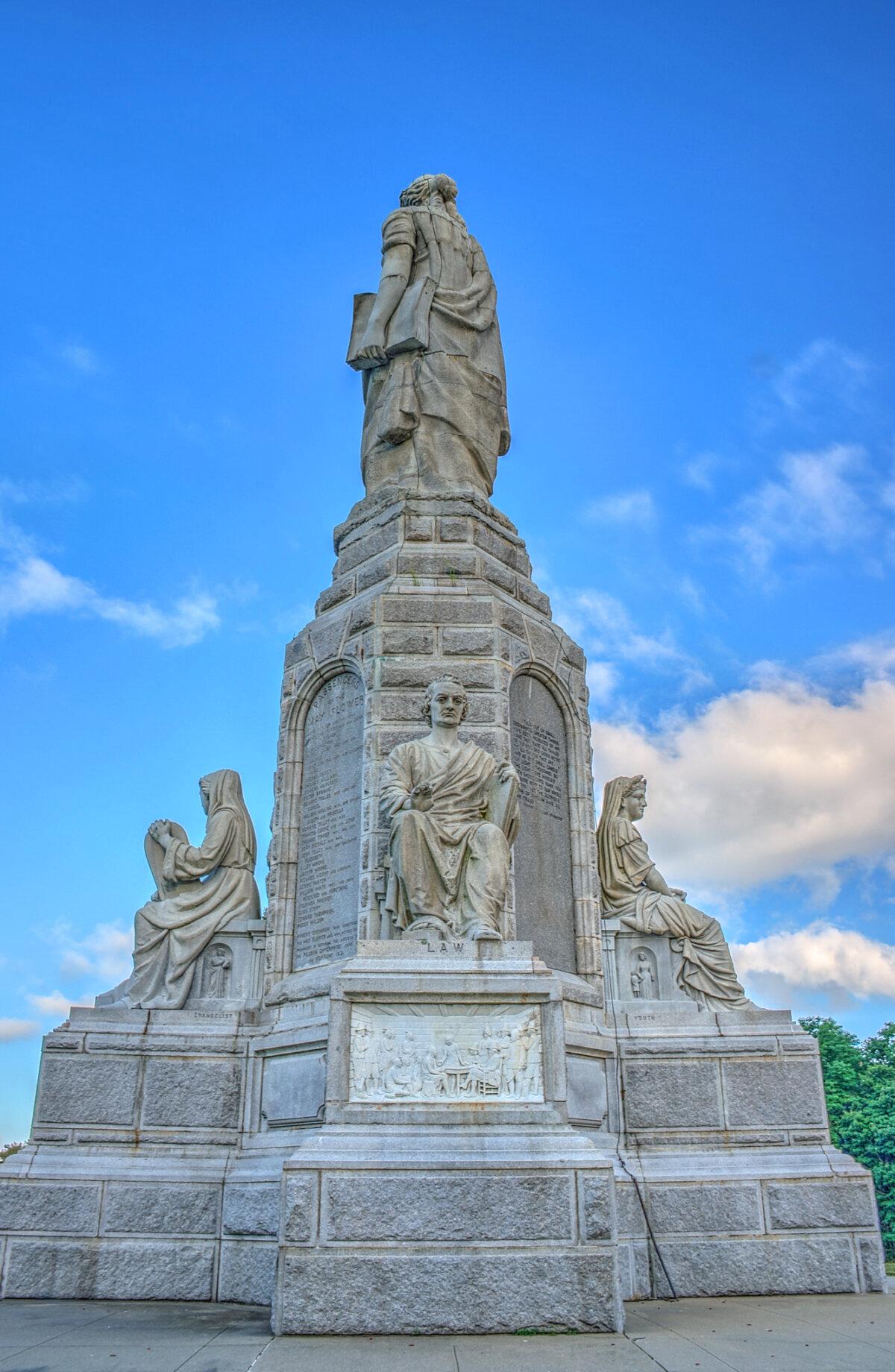 Law is seated holding what appears to be a book of laws. (<a href="https://commons.wikimedia.org/wiki/User:Dsdugan" target="_blank" rel="nofollow noopener">Dsdugan</a>/<a href="https://en.wikipedia.org/wiki/National_Monument_to_the_Forefathers#/media/File:15_23_0510_monument_law.jpg" target="_blank" rel="nofollow noopener">CC BY-SA 4.0</a>)