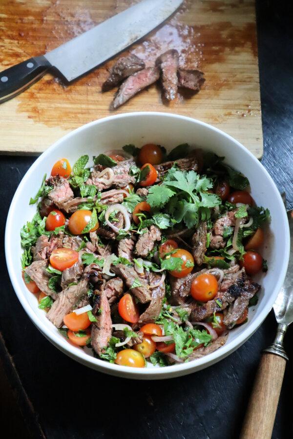 Made with budget-friendly skirt steak, Vietnamese beef salad is a great source of protein. A piquant lime-and-fish sauce dressing and shallots add tang. (Gretchen McKay/Pittsburgh Post-Gazette/TNS)
