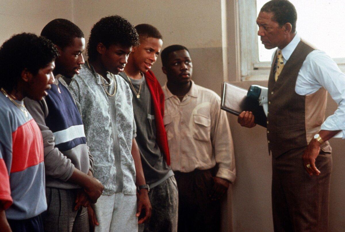 Principal Clark (Morgan Freeman, R) speaks to students, in "Lean on Me." (MovieStillsDB)
