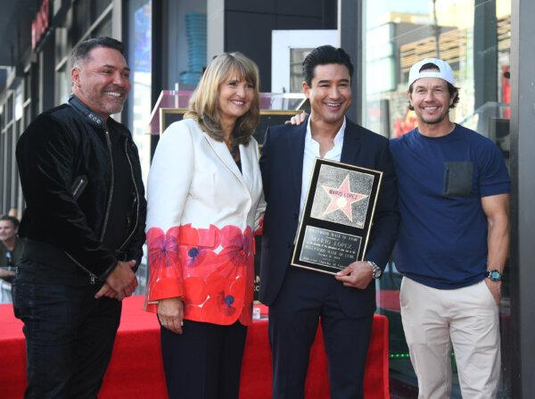 Oscar De La Hoya, Valari Staab, Mario Lopez, and Mark Wahlberg attend a ceremony honoring Mario Lopez with a star on the Hollywood Walk Of Fame in Los Angeles on Oct. 10, 2024. (Alberto E. Rodriguez/Getty Images)