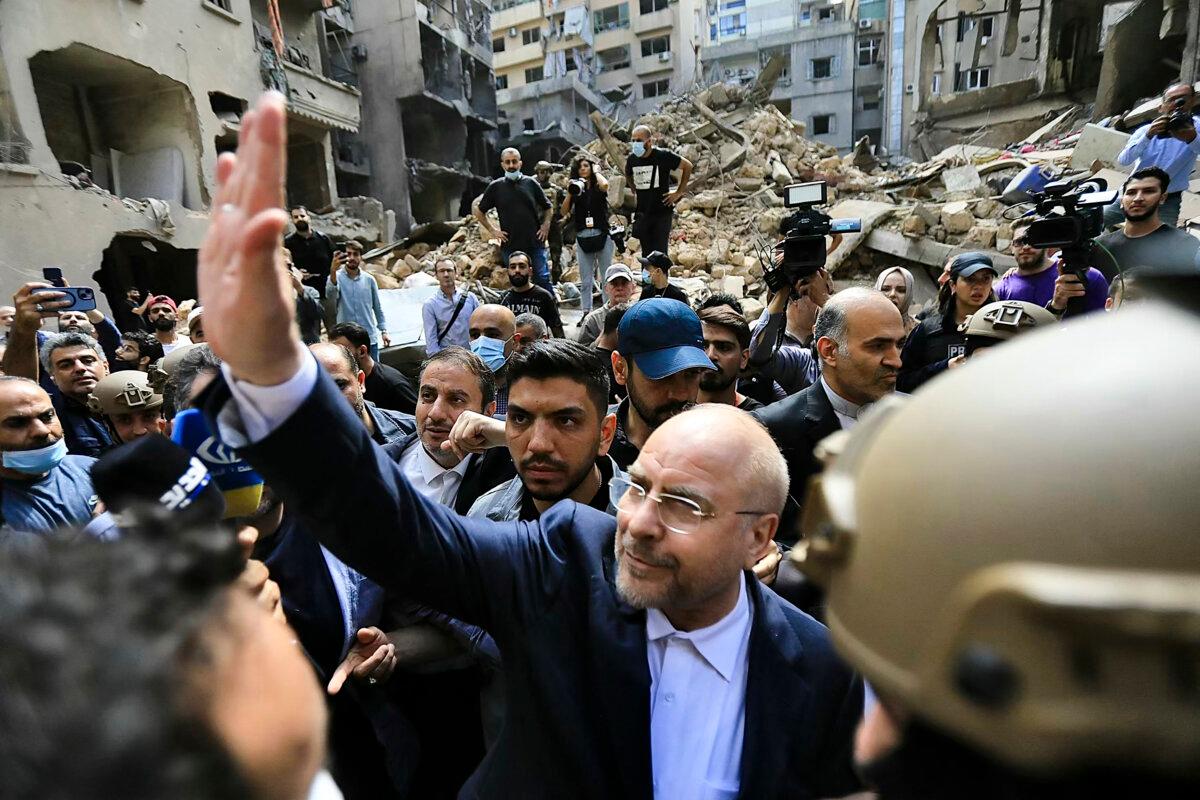 Iranian Parliament Speaker Mohammad Bagher Ghalibaf (C) waves as he returns to his car after visiting the site of an Israeli airstrike that targeted Beirut's Basta neighborhood in Lebanon on Oct. 12, 2024. (AFP via Getty Images)