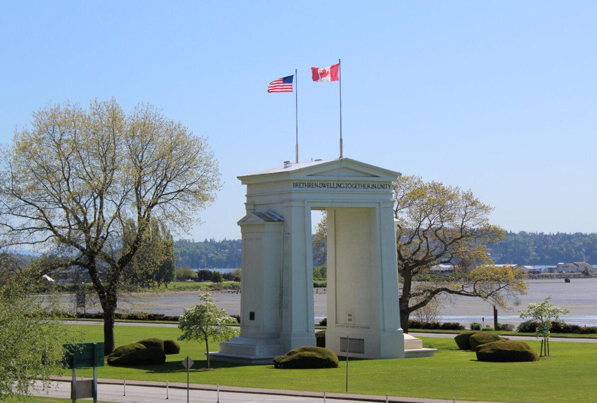 Flags fly above the Peace Arch monument on the border between the United States and Canada in Blaine, Washington, on Feb. 1, 2025. (Aprilflower/Shutterstock)