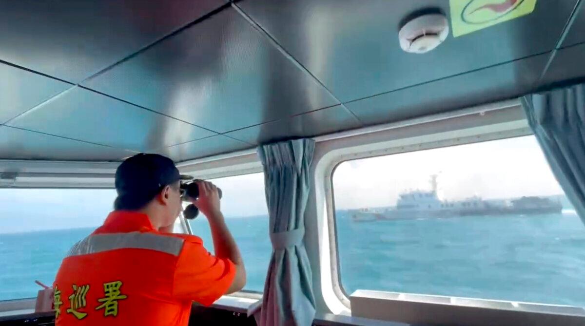 In this file image, a member of the Taiwanese coast guard monitors a Chinese coast guard boat as it passes near the coast of the Matsu islands, Taiwan, on Oct. 14, 2024, in a still from video. (Taiwan Coast Guard via AP)