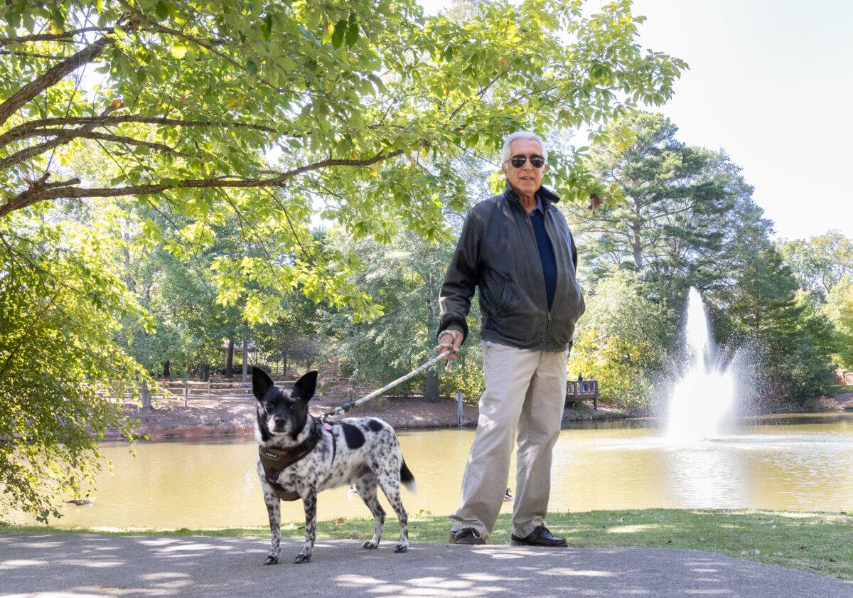 Leonard Freedman and his dog Oscar Bonner in Smyrna, GA., on Oct. 15, 2024. Freedman voted for former President Donald Trump earlier in the day. (John Fredricks/The Epoch Times)