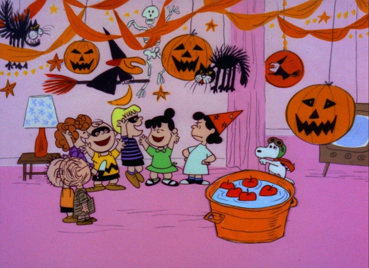 The characters of the "Peanuts" comic strip laugh at Violet's Halloween party. (MovieStillsDB)