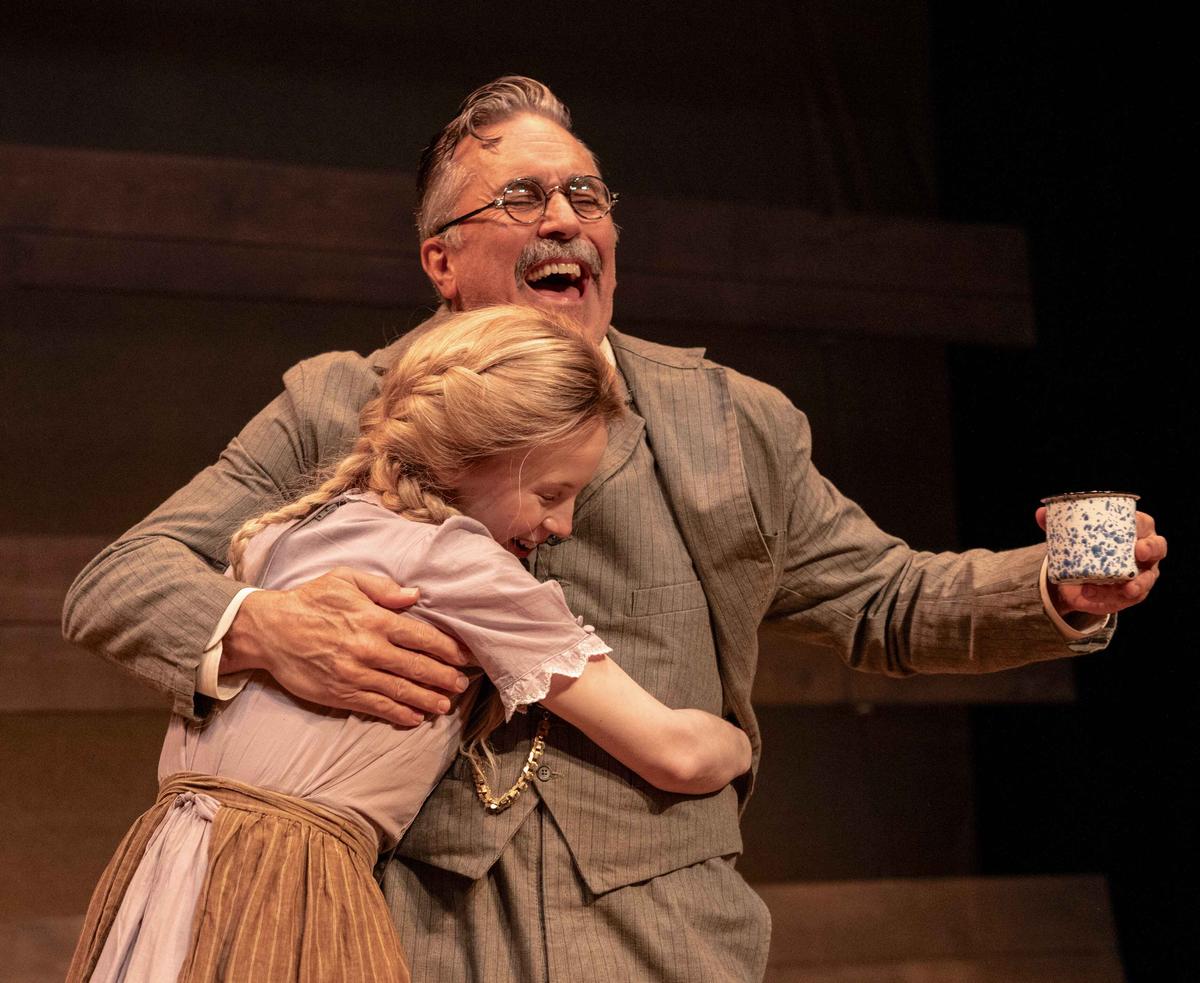 Willie (Mariah Lee) hugs her Uncle Jim (Richard Lear), in "Sump'n Like Wings." (Maria Baranova)