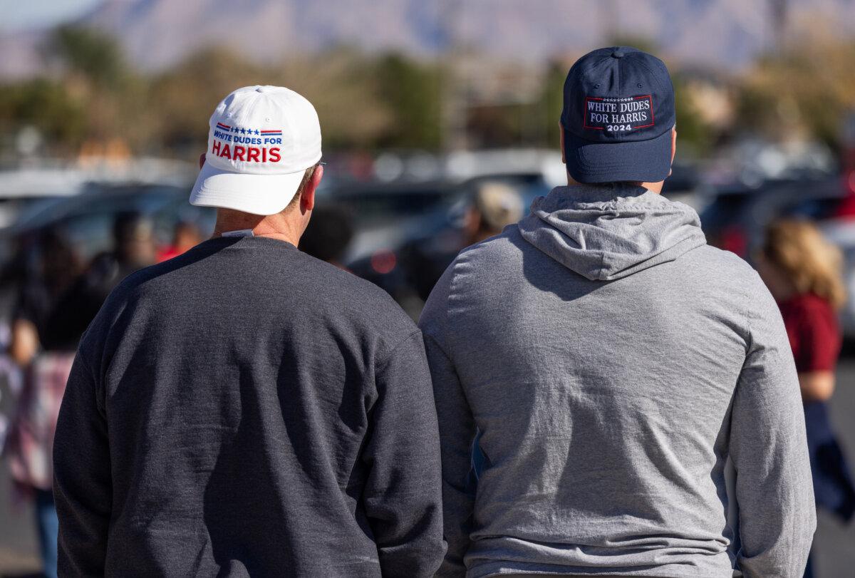 Lance (R) and Jack (L) wait in line to hear former U.S. President Barrack Obama speak in North Las Vegas, Nev., on Oct. 19, 2024. (John Fredricks/The Epoch Times)