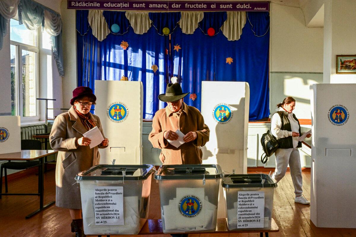 Moldovans vote in presidential elections and on a referendum on joining the European Union at a polling station in the village of Hirbovat, Moldova, on Oct. 20, 2024. (Daniel Mihailescu/AFP via Getty Images)