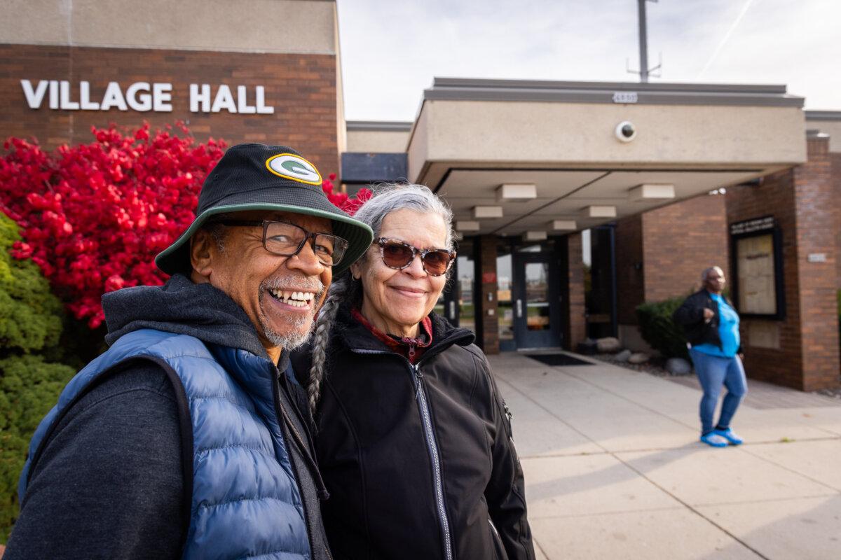 Carl Evans and Dollora Greene-Evans finish the early voting process in Brown Deer, Wisc., on Oct. 22, 2024. (John Fredricks/The Epoch Times)