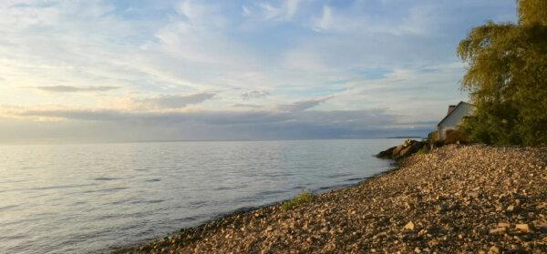 The sun sets over a small beach on Lake Michigan's shoreline at Peninsula Players Theatre in Door County, Wis. (Lacey Pfalz/TravelPulse/TNS)