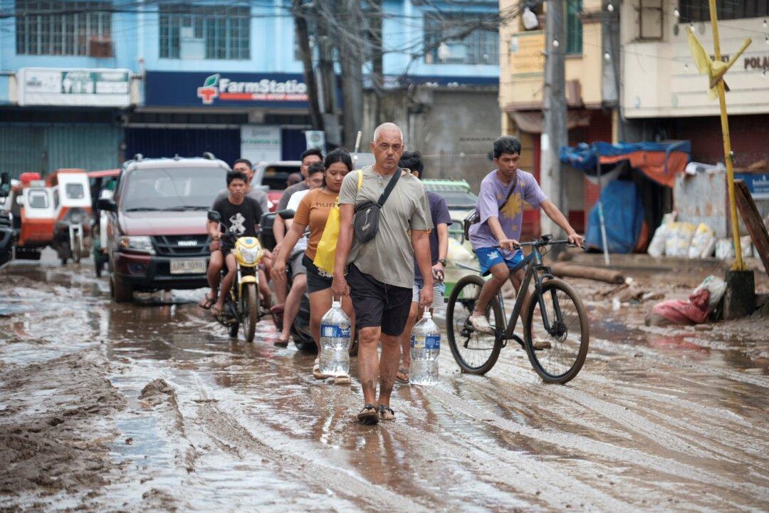 Floods in Philippines Kill at Least 9 and Trap Others on Roofs as Storm Approaches