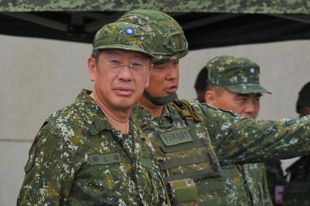 Taiwanese Defence Minister Wellington Koo (L) inspects troops during a live fire exercise at the Fanshan training grounds in Pingtung, Taiwan, on Aug. 26, 2024. (Sam Yeh/AFP via Getty Images)