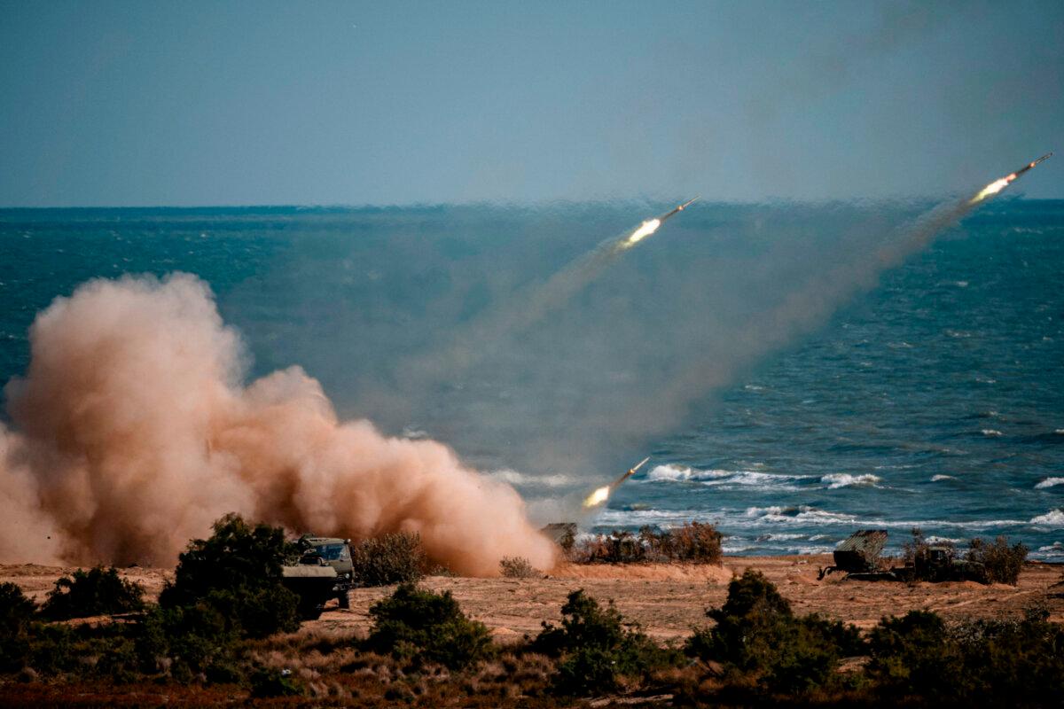 China, Russia, Iran, Pakistan, and Burma troops launch rockets from missile systems during the Caucasus-2020 military drills along the Caspian Sea in the Republic of Dagestan in southern Russia on Sept. 23, 2020. (Dimitar Dilkoff/AFP via Getty Images)