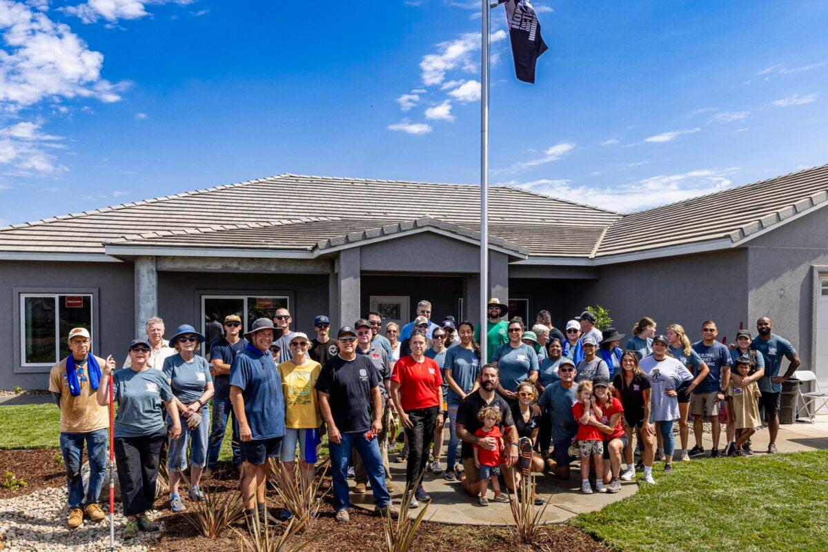 Volunteers show up to help Ramos do landscaping on his new home. (Courtesy of Youngren Construction)