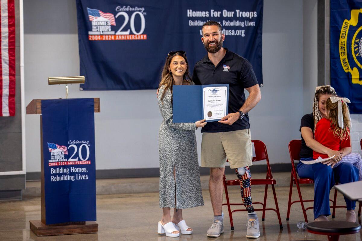 Ramos receives a certificate for his new home provided by Homes For Our Troops. (Courtesy of Youngren Construction)