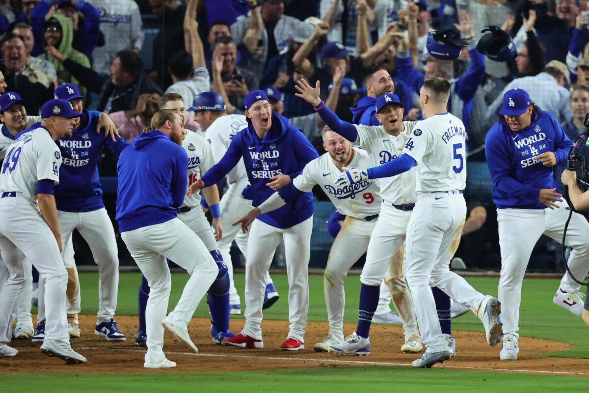 The Los Angeles Dodgers celebrate the walk-off grand slam hit by Freddie Freeman #5 to win Game One of the 2024 World Series against the New York Yankees at Dodger Stadium in Los Angeles on Oct. 25, 2024. (Alex Slitz/Getty Images)