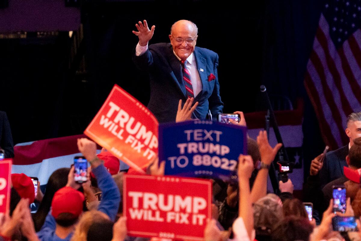 Former New York City Mayor Rudy Giuliani arrives on stage during a campaign rally for former President Donald Trump at Madison Square Garden, on Oct. 27, 2024. (Samira Bouaou/The Epoch Times)