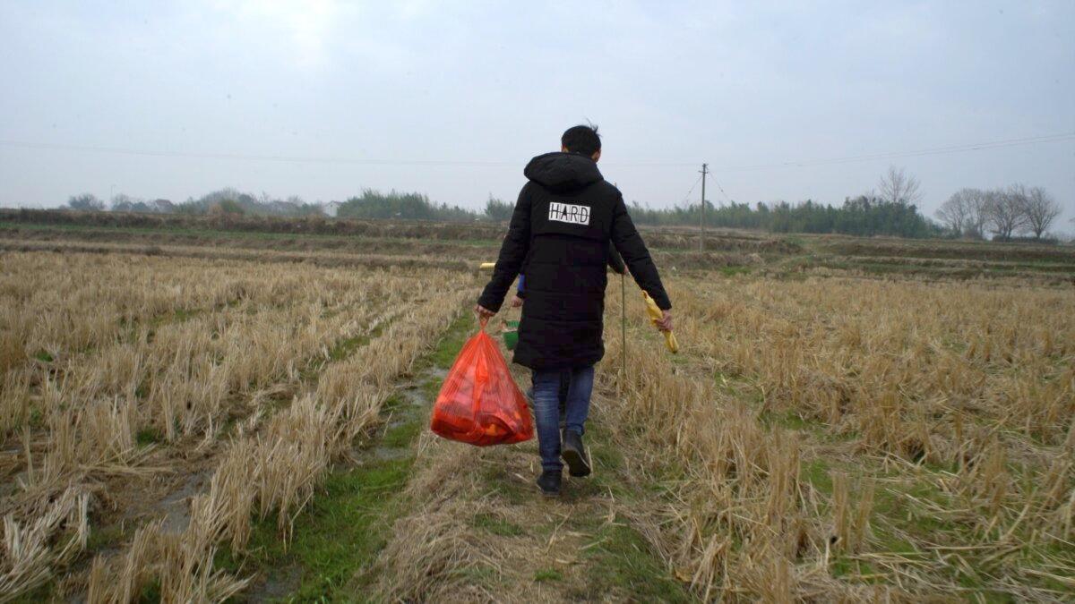 Back in his hometown, a young worker brings fireworks for the New Year celebrations, in "Homecoming." (Icarus Films)