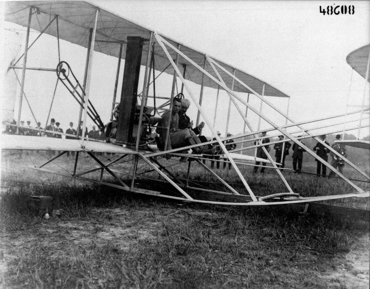 Orville Wright and Lt. Thomas Selfridge sit in the Wright flyer before taking off in a demonstration for the U.S. Army Signal Corps on Sept. 17, 1908. (<a href="https://commons.wikimedia.org/wiki/File:Wright_and_Selfridge_in_Wright_flyer_before_flight_(MIS_63-720-5),_National_Museum_of_Health_and_Medicine_(3323202385).jpg" target="_blank" rel="nofollow noopener">National Museum of Health and Medicine</a>/<a href="https://creativecommons.org/licenses/by/2.0/deed.en" target="_blank" rel="nofollow noopener">CC BY 2.0</a>)